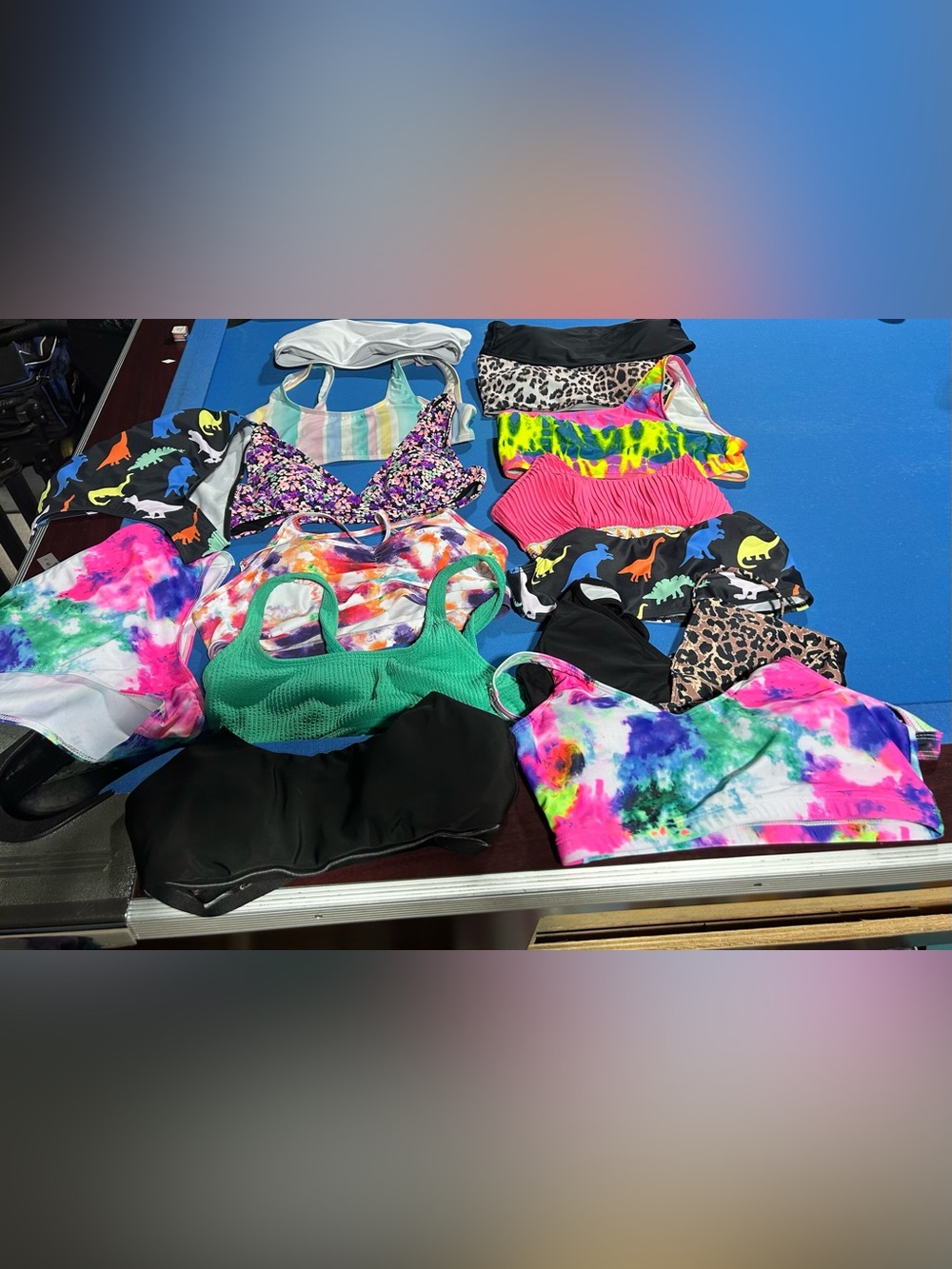 Assorted bathing suit tops and bottoms. 13 tops all size L. 2 bottoms size L